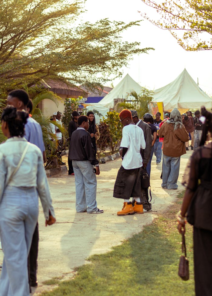 gallery-05 Group of people socializing at an outdoor event in Ado Ekiti, Nigeria.