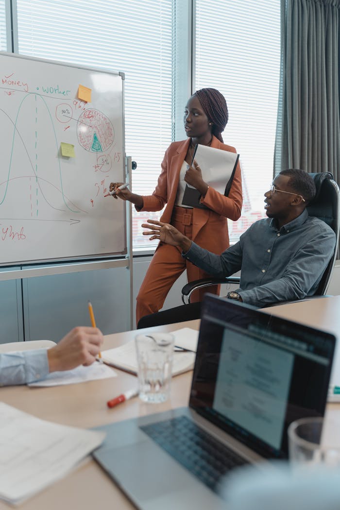 A diverse team discusses strategies during a meeting in a modern office setting.